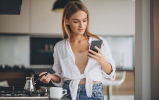 Woman in his kitchen reading addiction quotes for family members of addicts