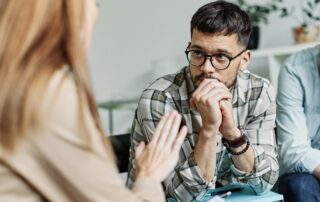 Man talking about mental health issues during outpatient dual diagnosis care